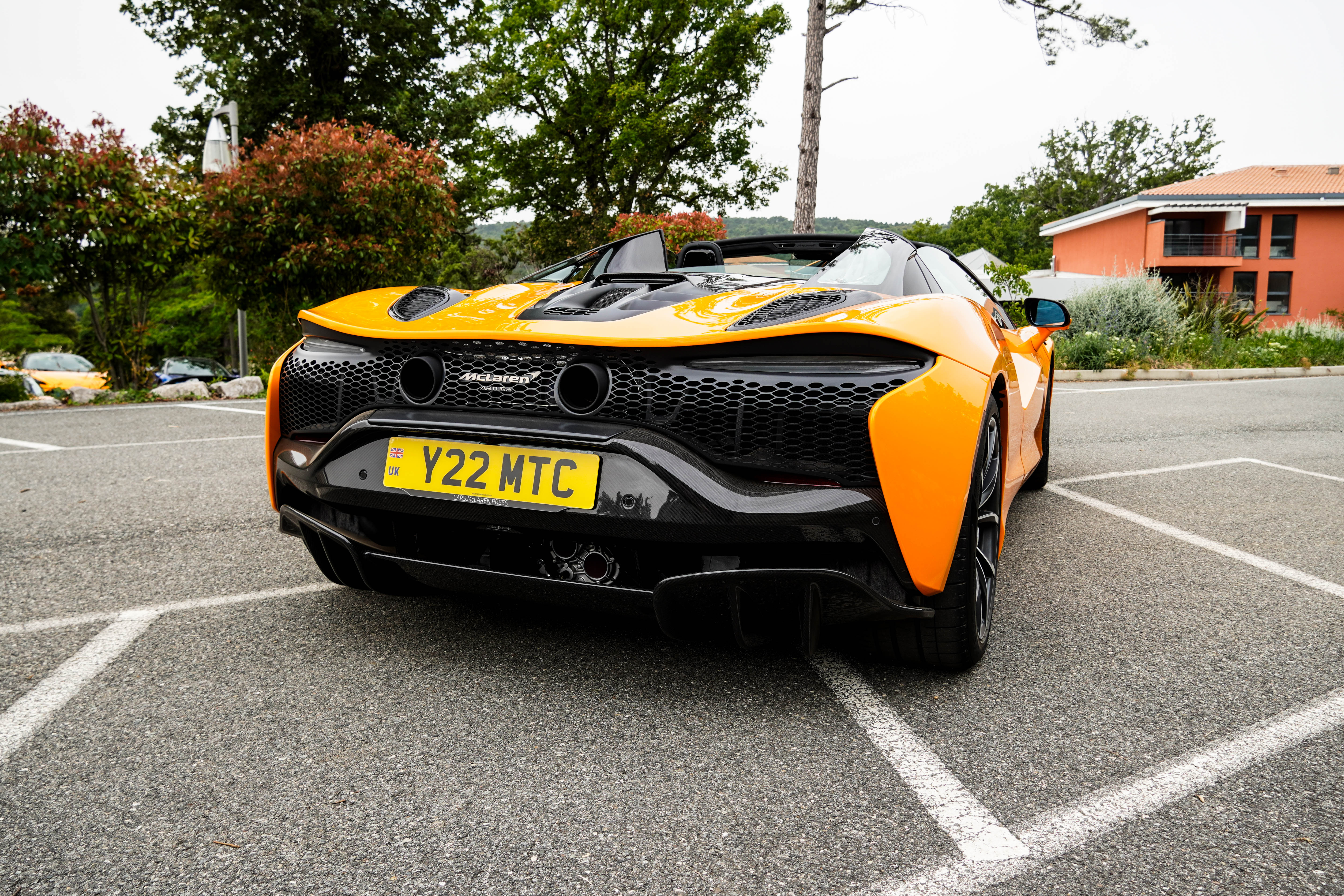 Rear end of an orange McLaren Artura Spider