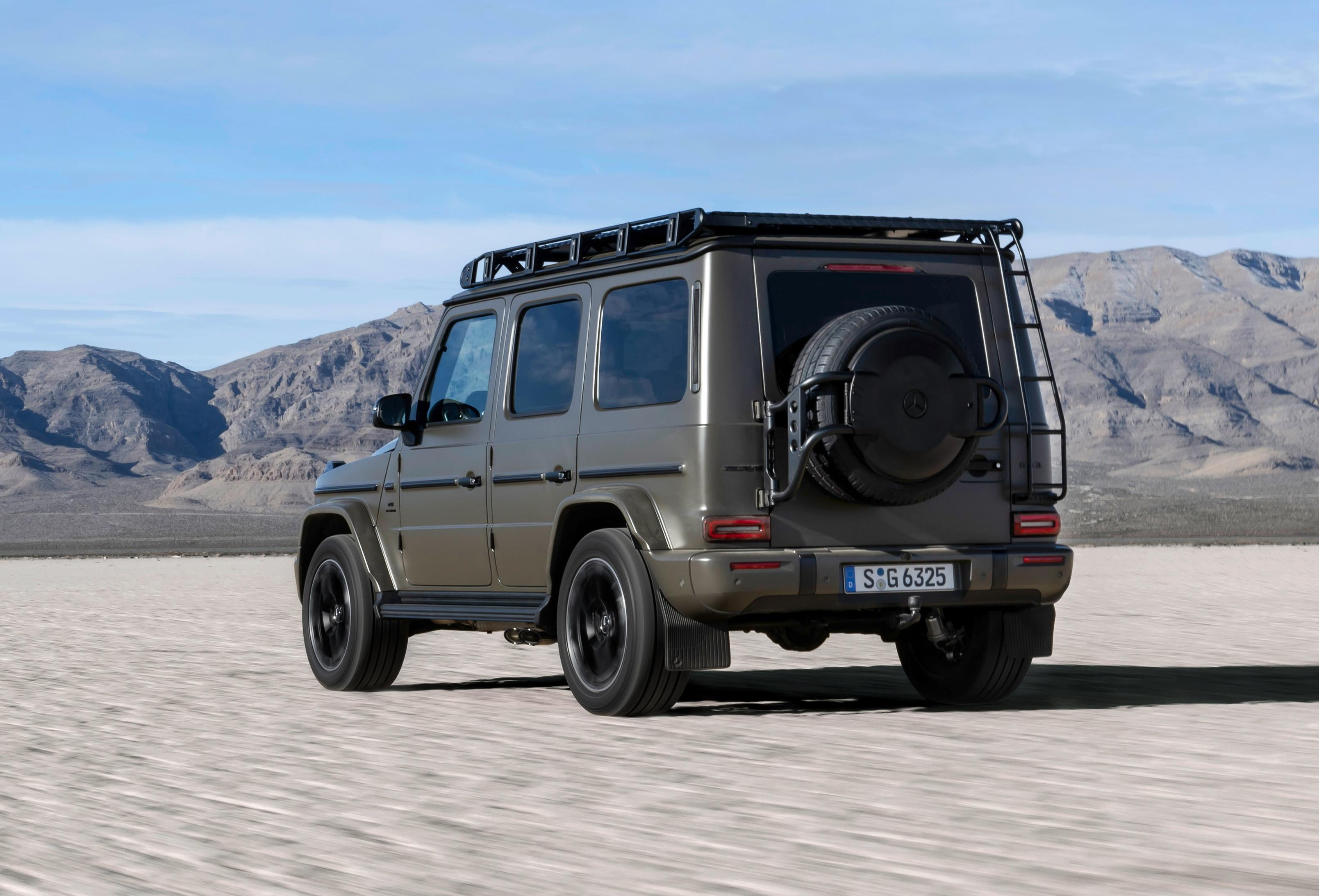 Rear 3/4 view of a Dark Olive Green Magno 2025 Mercedes-AMG G63