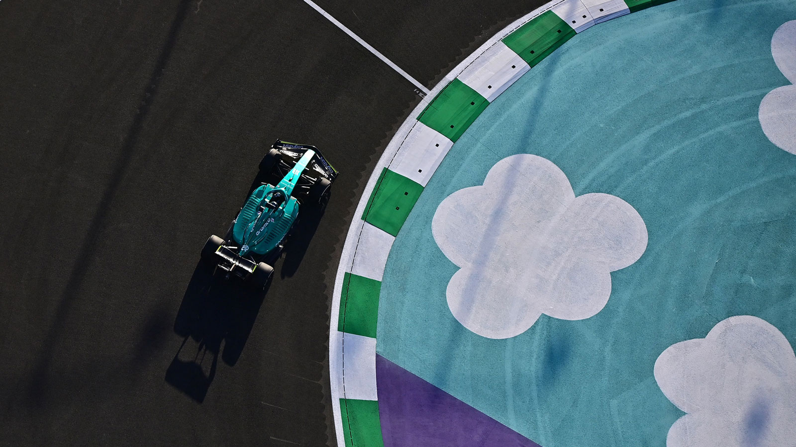 A photo of the Aston Martin car racing in Saudi Arabia. 