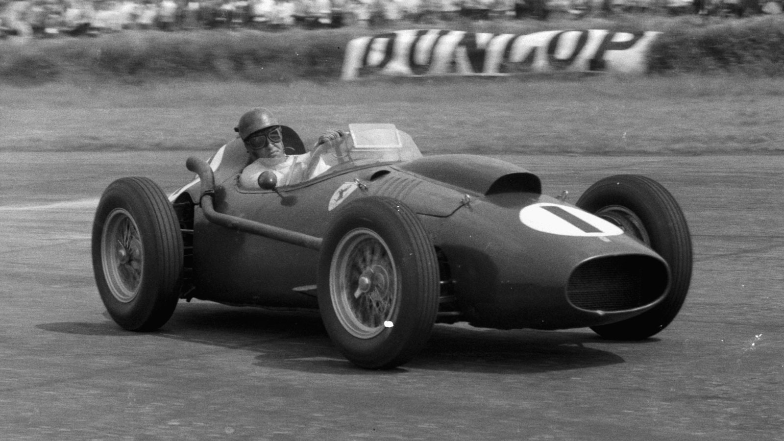 A black and white photo of the Ferrari 246 F1 car from 1958. 