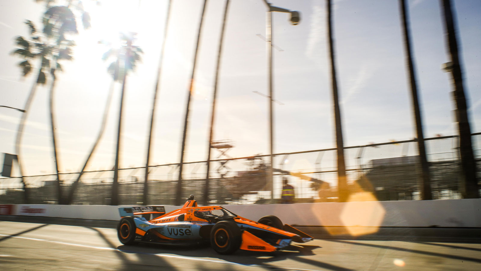 A photo of a Mclaren racing round the Long Beach circuit