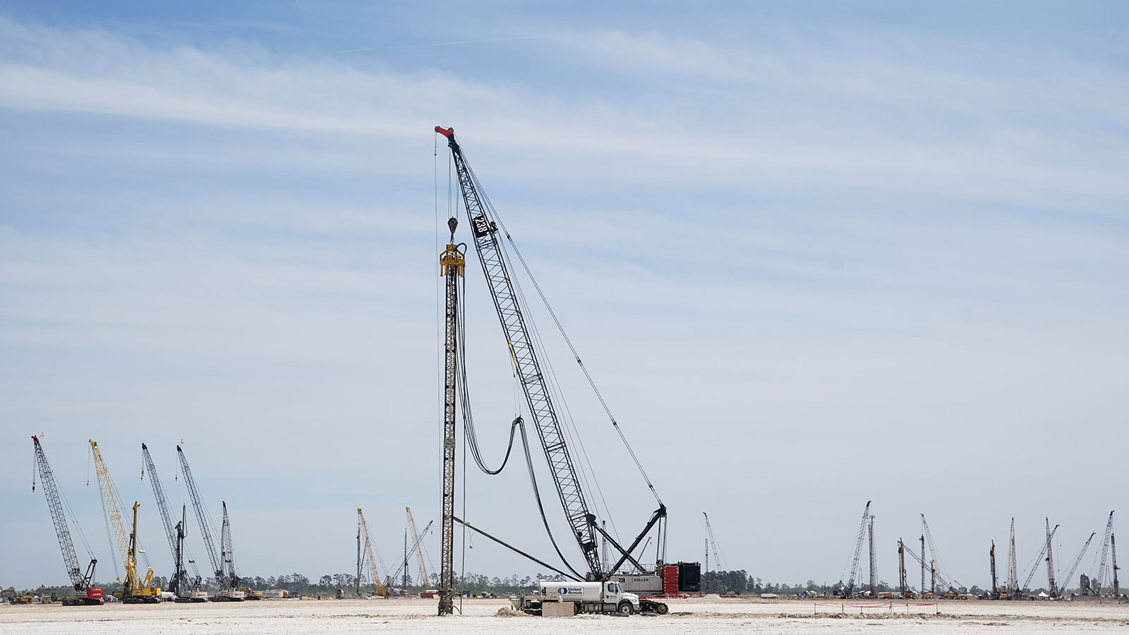 A photo of construction cranes at a site in Georgia. 