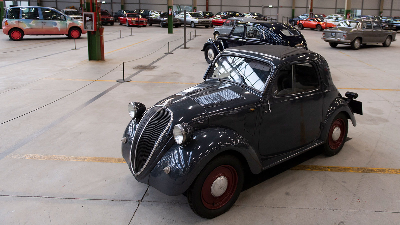 A photo of an original Fiat 500 car. 