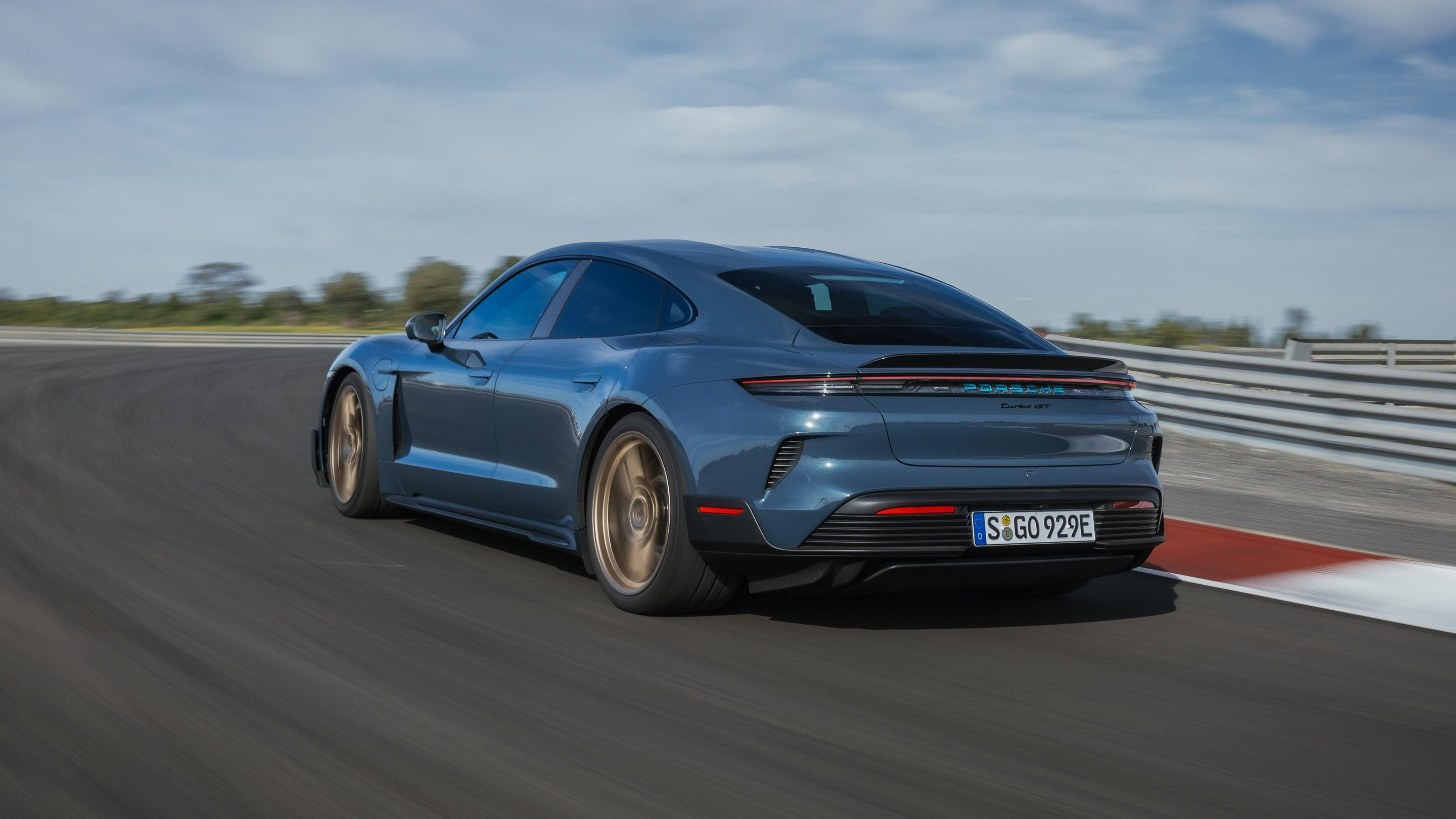 Rear 3/4 view of a blue Porsche Taycan Turbo GT