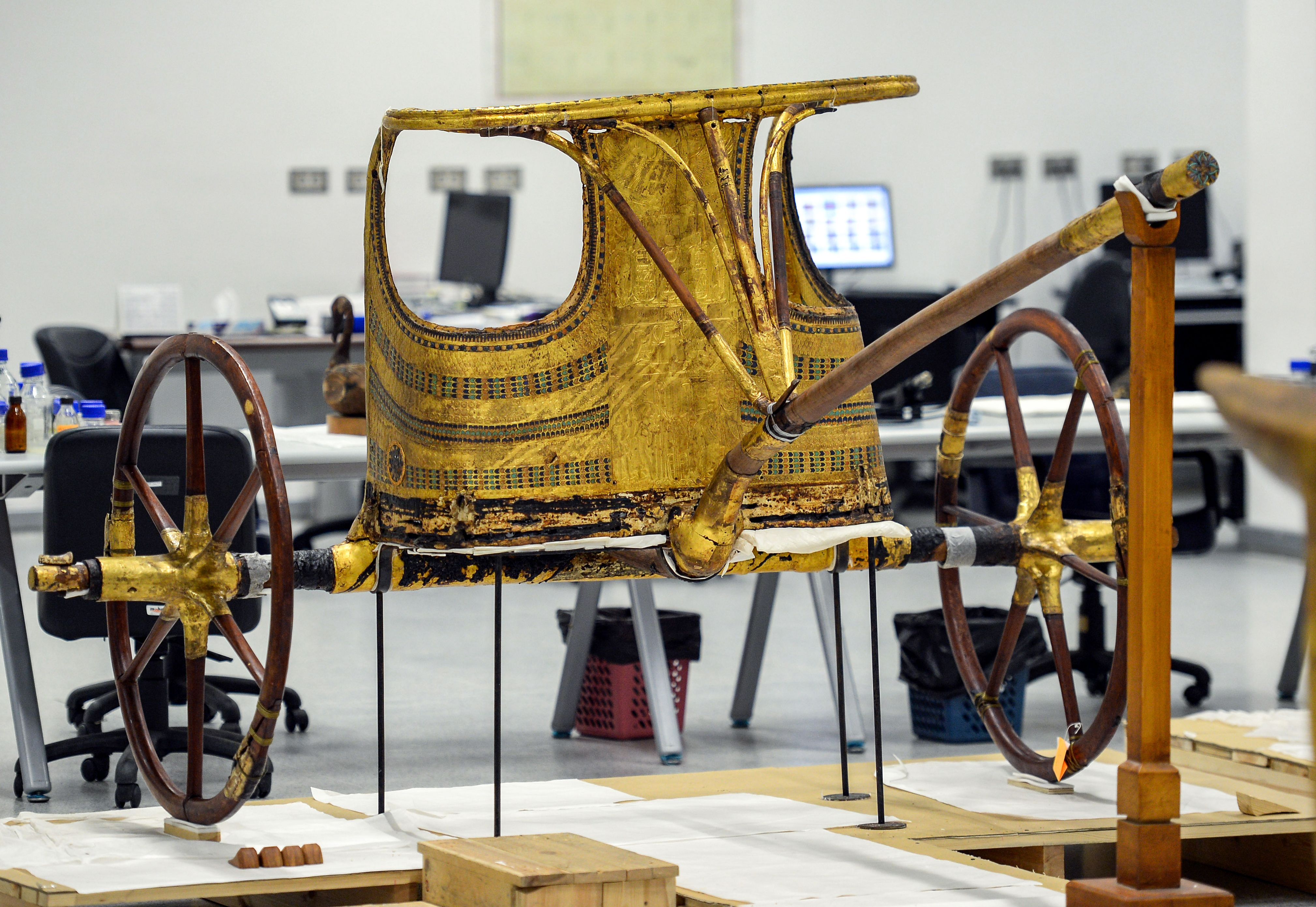 A gold chariot found in the tomb of Tutankhamun, now sitting fully restored in the Grand Egyptian Museum. 