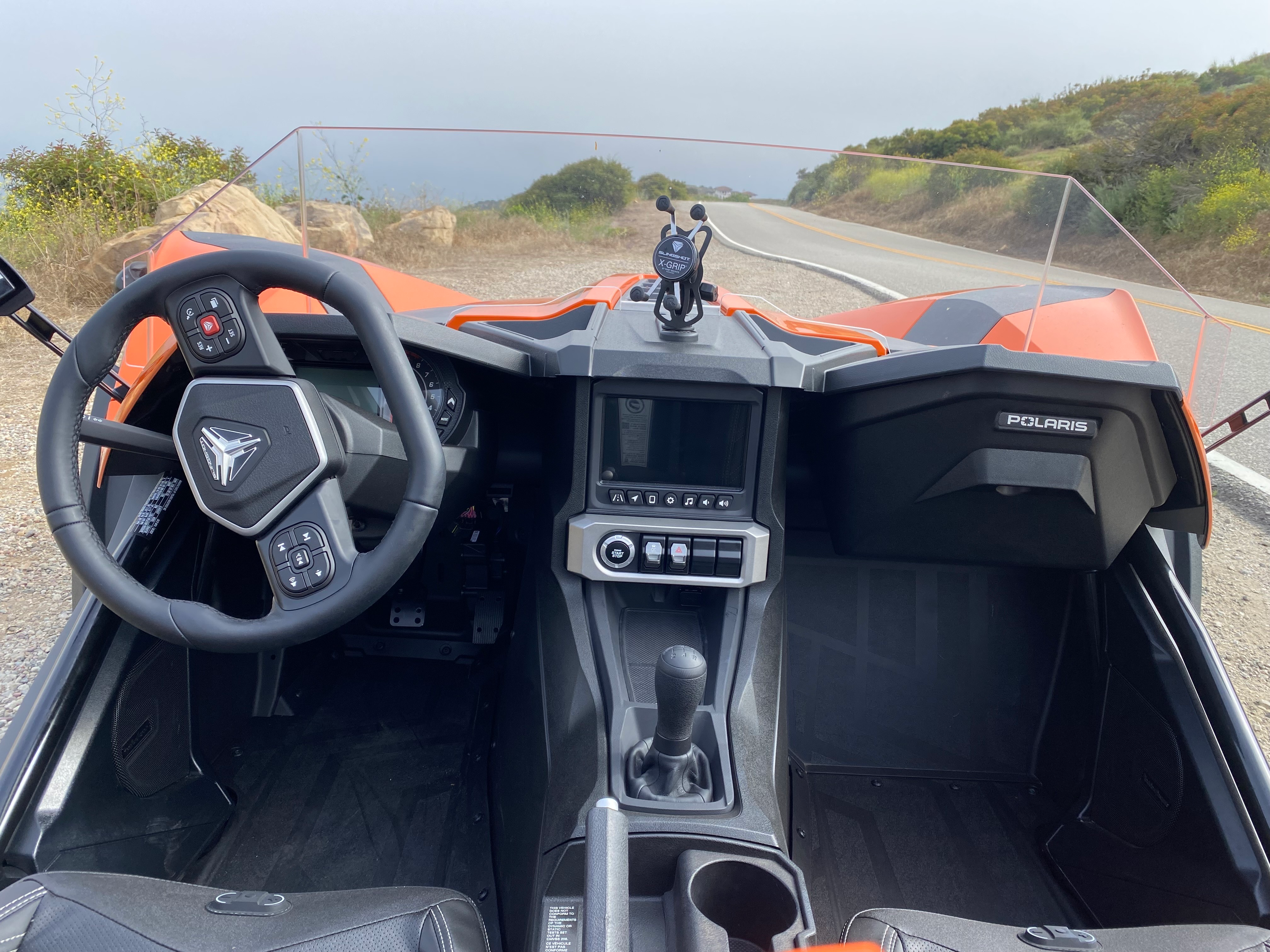 A photo showing the driver's view out the Slingshot