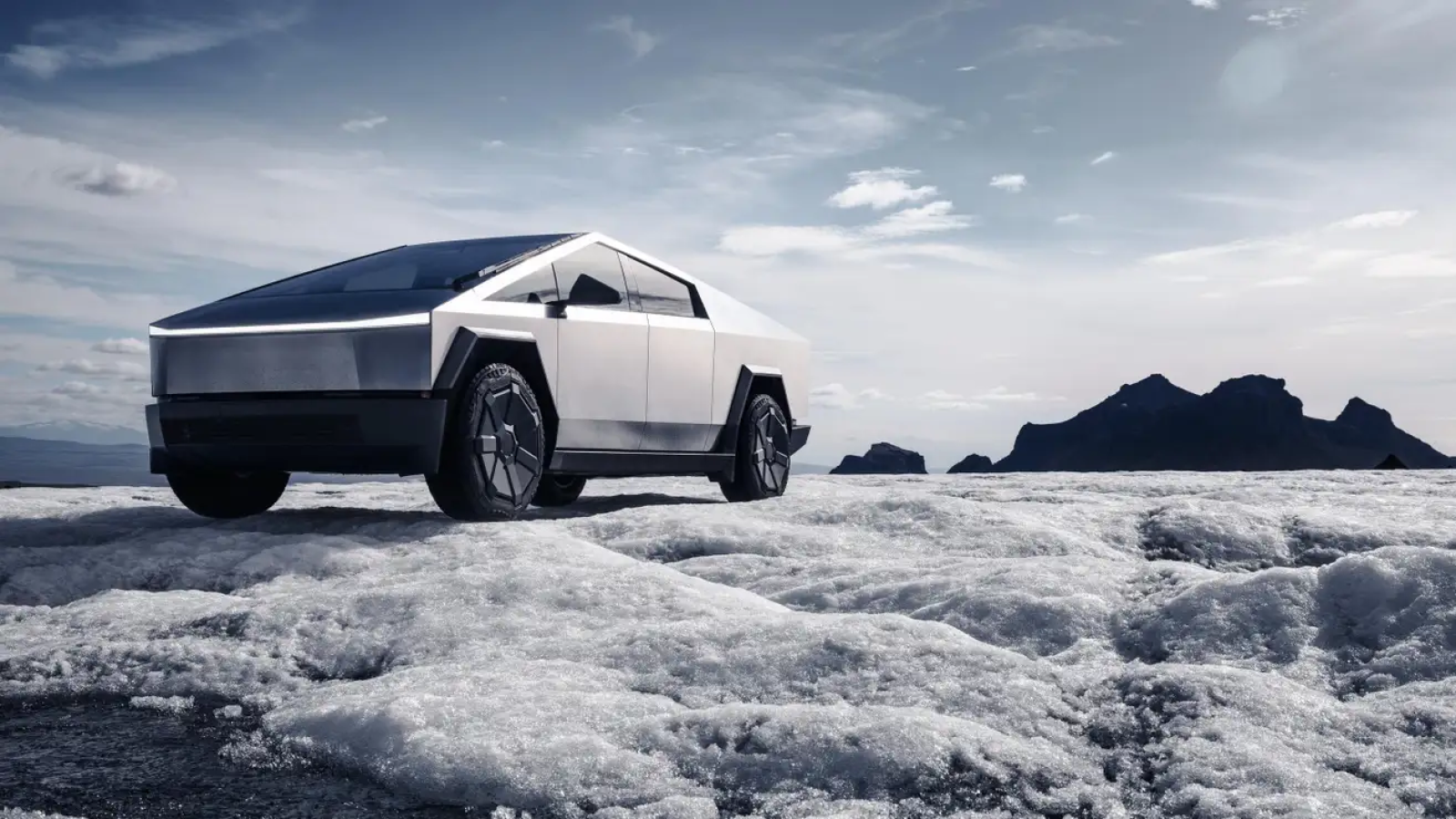 An image of a Tesla Cybertruck parked on snow. 