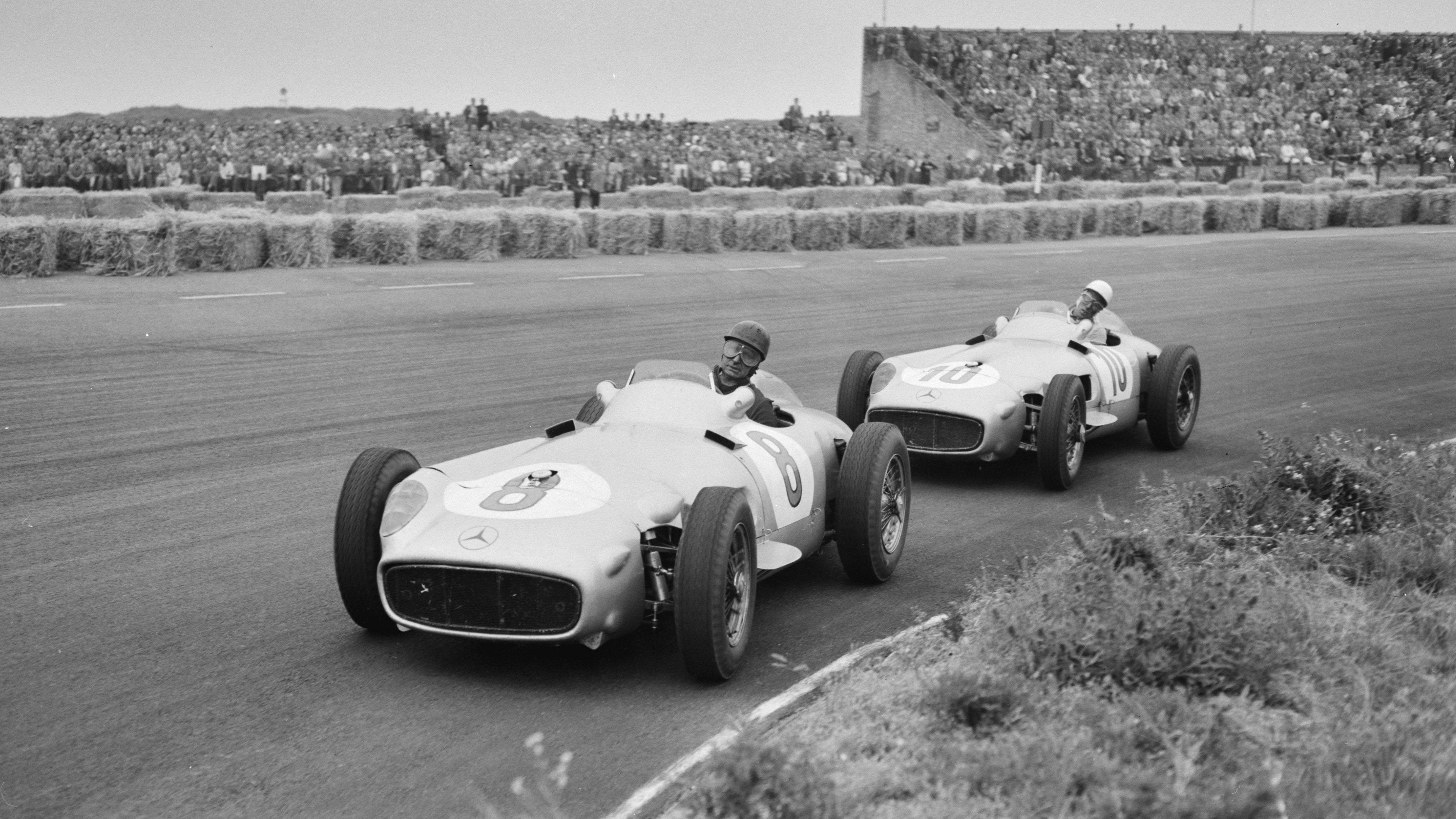 A pair of open-wheel Mercedes-Benz W196 R during the 1955 Dutch Grand Prix