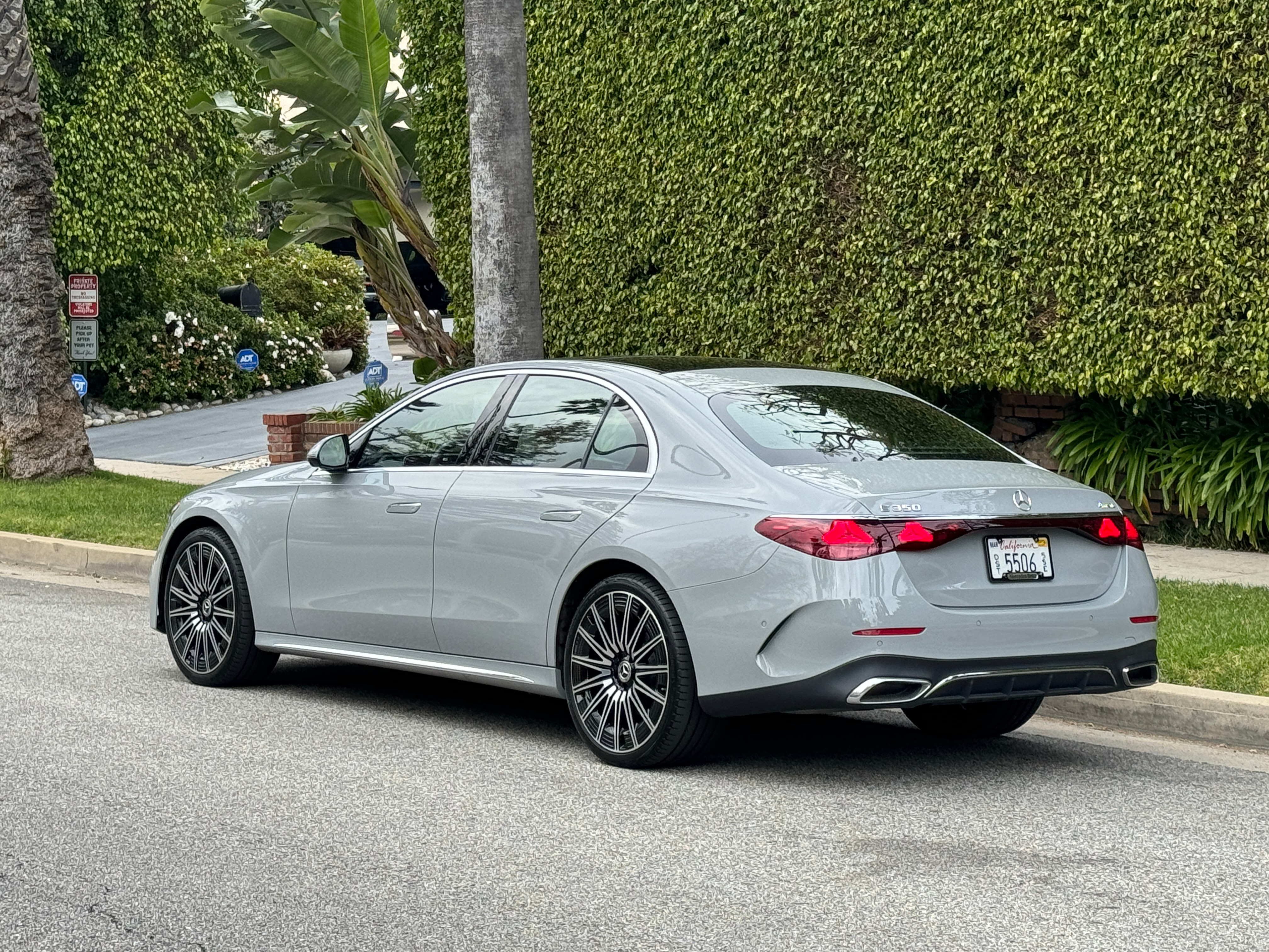 Rear 3/4 view of a grey 2024 Mercedes-Benz E350