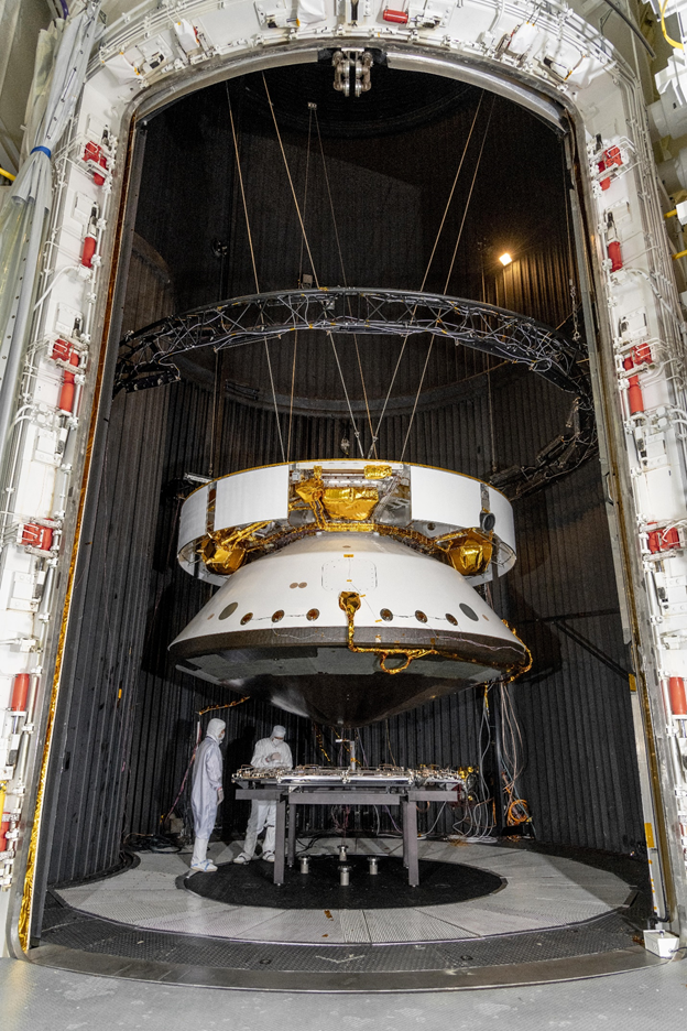 A picture of the assembled spacecraft next to people to give you a sense of the scale. 